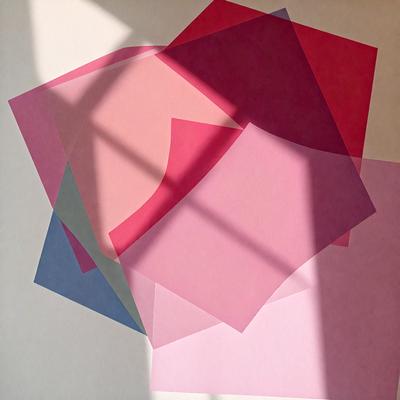 The primary subject of the image is a pink and blue square, which is part of a larger artwork. The setting is a room with a window, and the visual style appears to be a combination of digital art and illustration. The dominant colors in the image are pink and blue, creating a warm and inviting atmosphere.